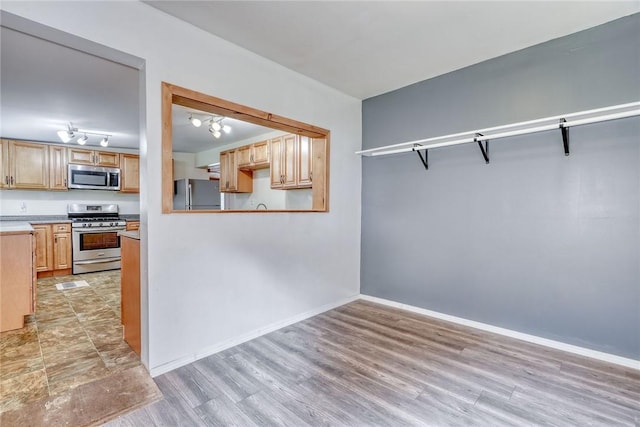 6608 Scenery Pl, Conesus, NY 14435 - unfurnished dining area with light wood-type flooring and baseboards