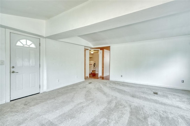 6608 Scenery Pl, Conesus, NY 14435 - carpeted entrance foyer with lofted ceiling, baseboards, and washer / clothes dryer
