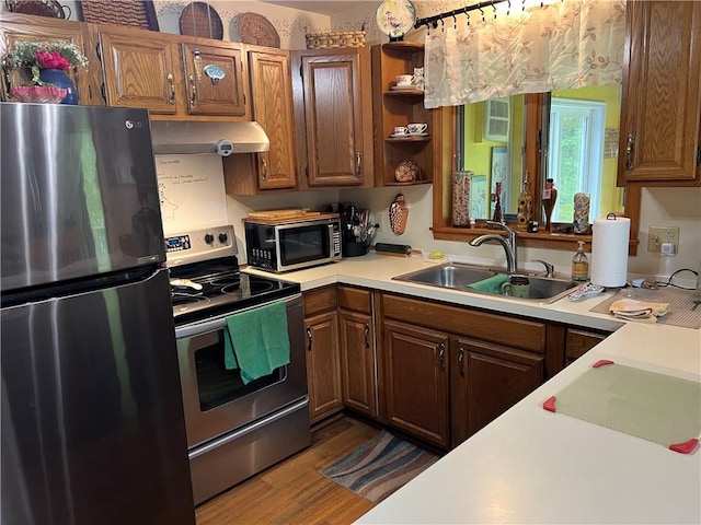 3259 Freer Hollow Rd, Franklin, NY 13856 - kitchen featuring stainless steel appliances, a sink, exhaust hood, light countertops, and dark wood-type flooring