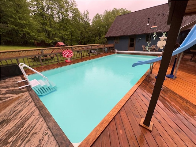 3259 Freer Hollow Rd, Franklin, NY 13856 - outdoor pool with a water slide, a deck, and a playground