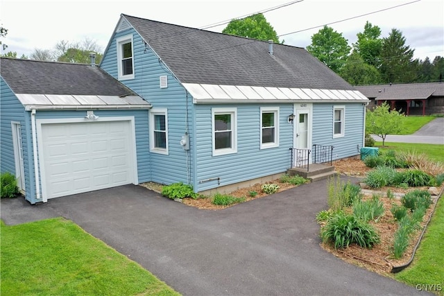 6302 Meadow Dr, Lee, NY 13440 - cape cod house featuring an attached garage, asphalt driveway, and roof with shingles