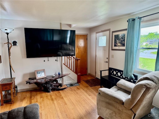 6302 Meadow Dr, Lee, NY 13440 - living area with stairway, wood finished floors, and baseboards