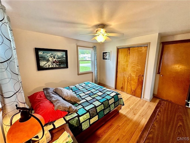 6302 Meadow Dr, Lee, NY 13440 - bedroom featuring wood finished floors, a closet, a ceiling fan, and baseboards