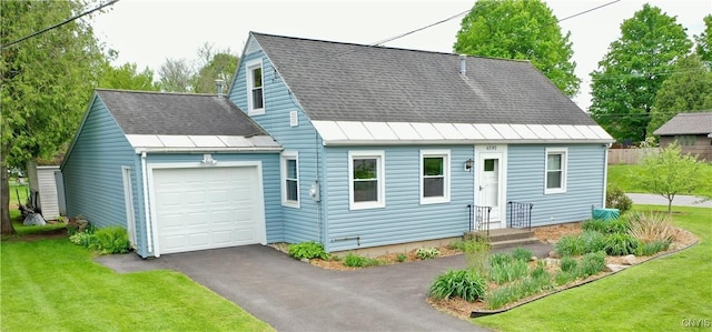 6302 Meadow Dr, Lee, NY 13440 - cape cod-style house featuring an attached garage, a front lawn, asphalt driveway, a standing seam roof, and a shingled roof