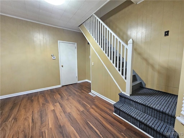2207 Linwood Ave, Niagara Falls, NY 14305 - staircase with wood finished floors, baseboards, crown molding, and wooden walls