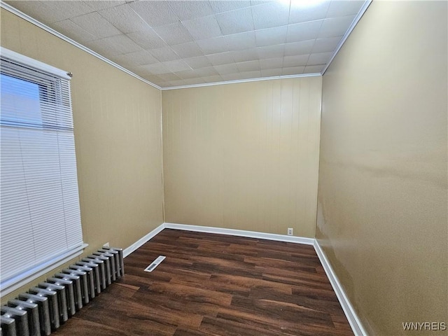 2207 Linwood Ave, Niagara Falls, NY 14305 - unfurnished room with radiator, ornamental molding, wood finished floors, and baseboards
