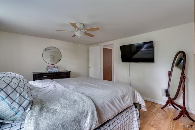 163 Maple St, Le Ray, NY 13612 - bedroom featuring light wood-style floors, a ceiling fan, and baseboards