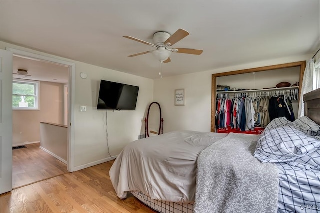 163 Maple St, Le Ray, NY 13612 - bedroom featuring a closet, light wood-style floors, a ceiling fan, and baseboards