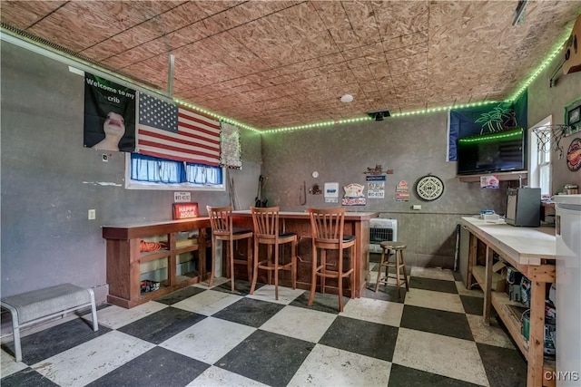 163 Maple St, Le Ray, NY 13612 - indoor dry bar with tile patterned floors and an ornate ceiling
