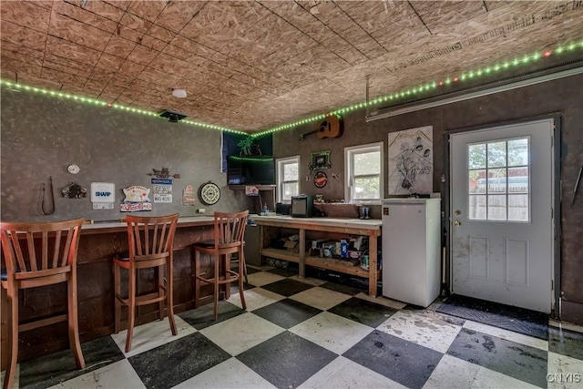 163 Maple St, Le Ray, NY 13612 - dining room featuring an ornate ceiling, tile patterned floors, and a bar