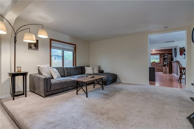 163 Maple St, Le Ray, NY 13612 - living room with healthy amount of natural light, carpet floors, and baseboards