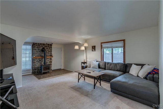 163 Maple St, Le Ray, NY 13612 - living room featuring a wood stove and carpet