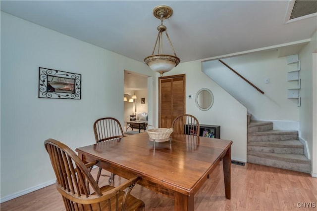 163 Maple St, Le Ray, NY 13612 - dining room with stairs, light wood finished floors, and baseboards