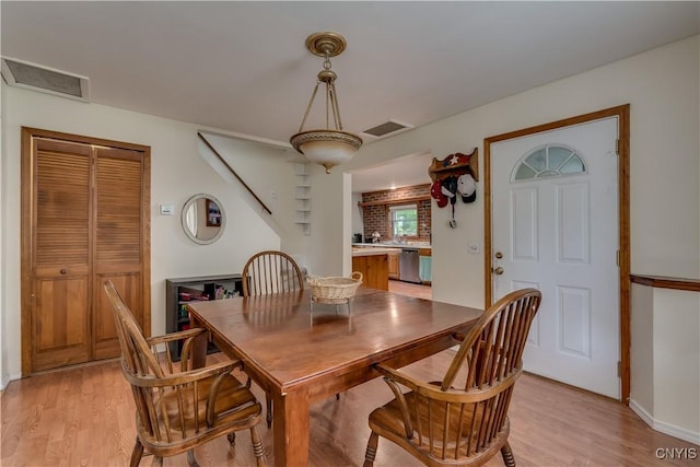 163 Maple St, Le Ray, NY 13612 - dining area featuring light wood-style flooring and baseboards