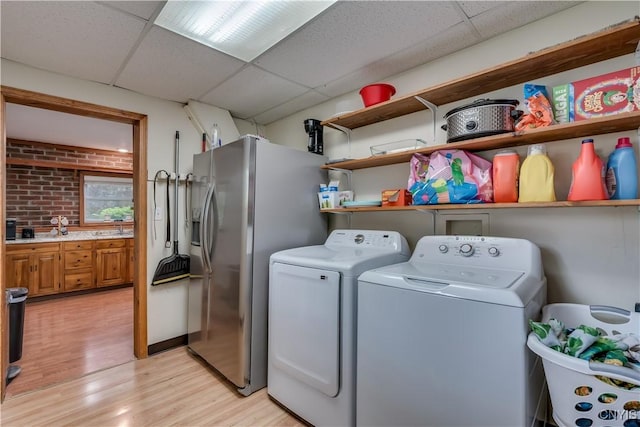 163 Maple St, Le Ray, NY 13612 - washroom with light wood-type flooring and washer and dryer