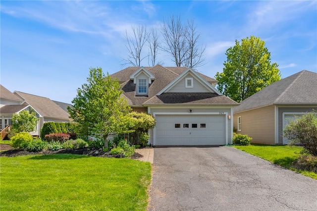 763 Bel Arbor Trl, Webster, NY 14580 - view of front of house with a front yard, asphalt driveway, and a garage