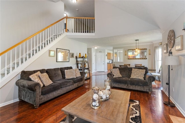 763 Bel Arbor Trl, Webster, NY 14580 - living area featuring wood finished floors, stairs, high vaulted ceiling, baseboards, and a chandelier