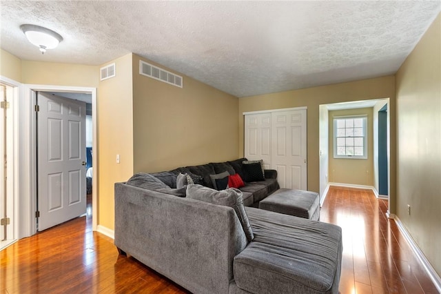 763 Bel Arbor Trl, Webster, NY 14580 - living area featuring hardwood / wood-style flooring, a textured ceiling, and baseboards