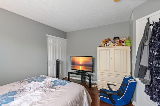 763 Bel Arbor Trl, Webster, NY 14580 - bedroom featuring dark wood-style floors and a textured ceiling