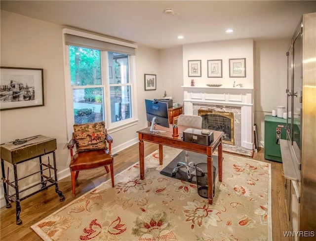 1225 W Arnold Dr, Hamburg, NY 14085 - office space featuring wood finished floors, a fireplace, recessed lighting, and baseboards