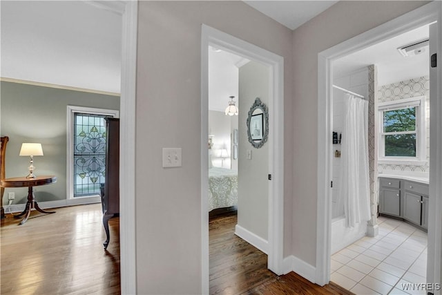 1225 W Arnold Dr, Hamburg, NY 14085 - hall featuring baseboards and wood finished floors