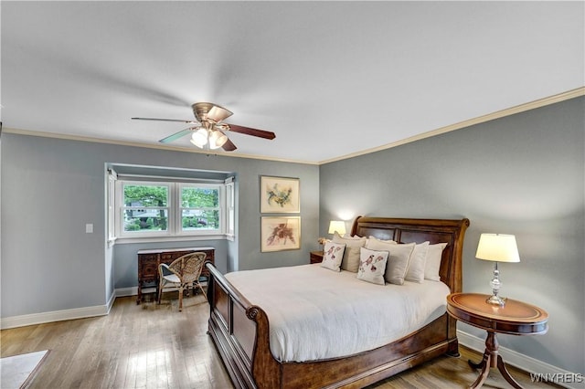 1225 W Arnold Dr, Hamburg, NY 14085 - bedroom with crown molding, baseboards, wood finished floors, and ceiling fan