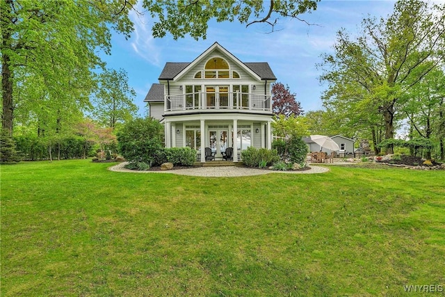 1225 W Arnold Dr, Hamburg, NY 14085 - back of property featuring french doors, a balcony, a yard, and a porch