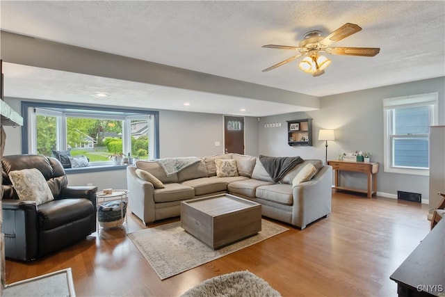 229 Brookfield Rd, Salina, NY 13211 - living room featuring wood finished floors, ceiling fan, a textured ceiling, and recessed lighting