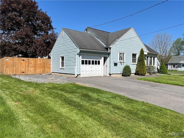 105 Woodland Dr, Cicero, NY 13212 - view of property exterior with an attached garage, asphalt driveway, and a shingled roof