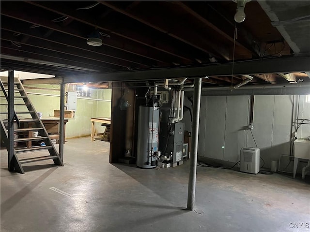 105 Woodland Dr, Cicero, NY 13212 - unfinished below grade area with gas water heater, heating unit, and electric panel