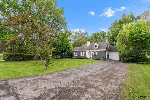 5024 Callan Dr, Lewiston, NY 14092 - cape cod house with asphalt driveway, a front lawn, an attached garage, and a chimney
