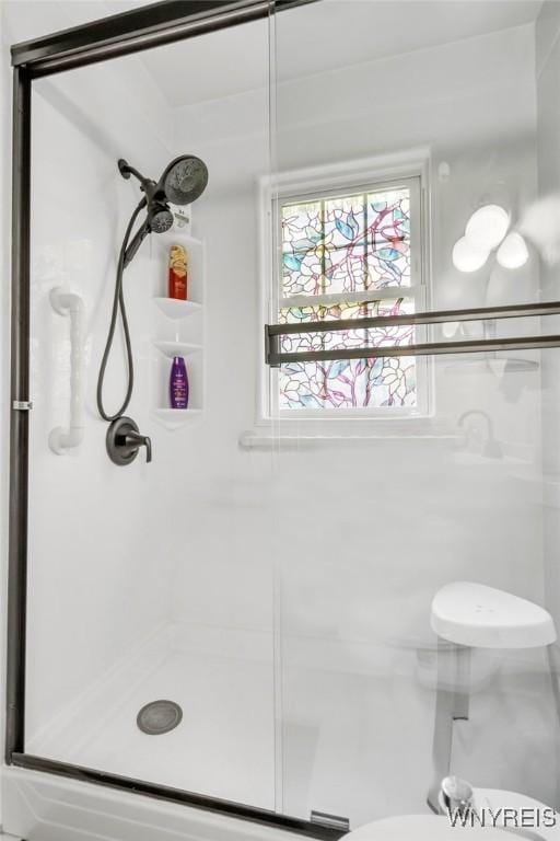 5024 Callan Dr, Lewiston, NY 14092 - bathroom featuring a stall shower and toilet