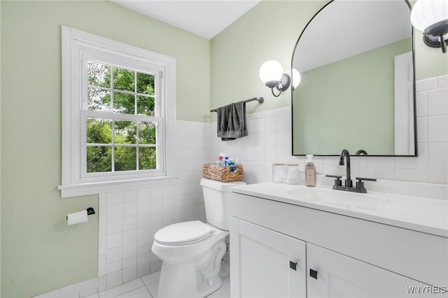 5024 Callan Dr, Lewiston, NY 14092 - bathroom featuring tile walls, vanity, toilet, and tile patterned floors