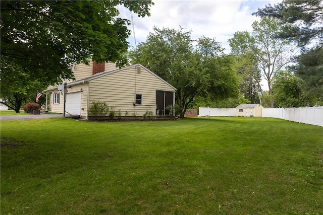 61 Brookside Cir, Big Flats, NY 14903 - view of yard featuring a garage and driveway