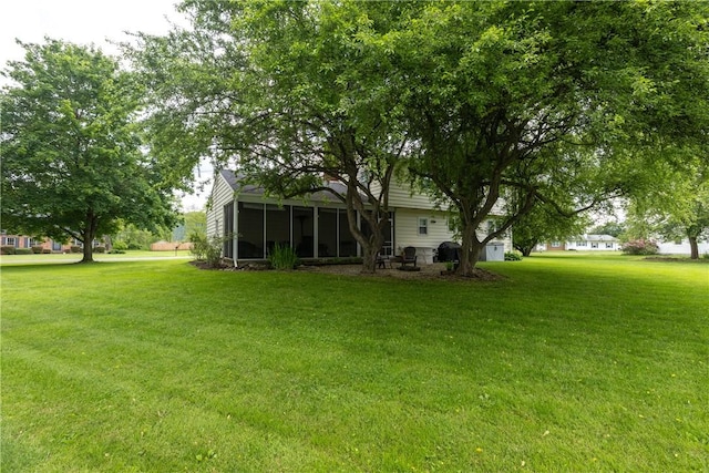 61 Brookside Cir, Big Flats, NY 14903 - view of green lawn featuring a sunroom