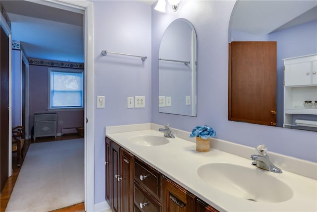 61 Brookside Cir, Big Flats, NY 14903 - full bathroom featuring baseboard heating and double vanity