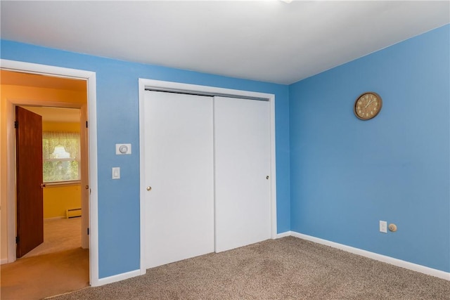 61 Brookside Cir, Big Flats, NY 14903 - unfurnished bedroom featuring carpet floors, baseboard heating, a closet, and baseboards
