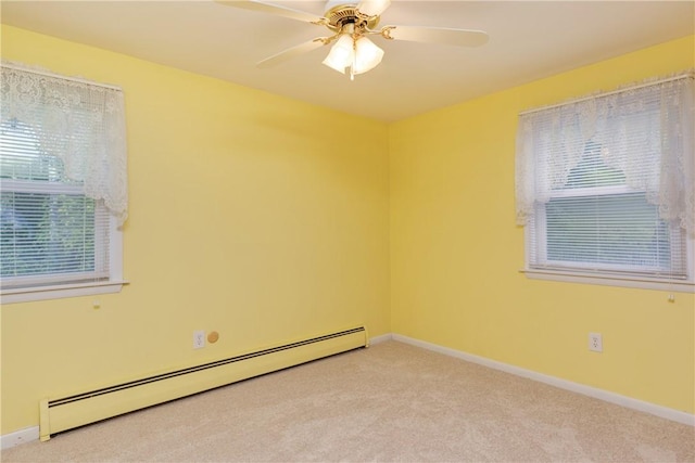 61 Brookside Cir, Big Flats, NY 14903 - spare room featuring a baseboard heating unit, light colored carpet, a ceiling fan, and baseboards