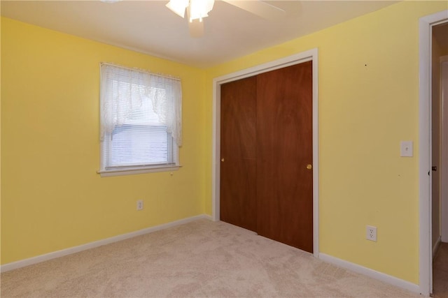 61 Brookside Cir, Big Flats, NY 14903 - unfurnished bedroom with a closet, carpet flooring, baseboards, and ceiling fan