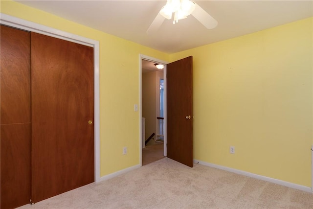 61 Brookside Cir, Big Flats, NY 14903 - unfurnished bedroom featuring light carpet, a closet, ceiling fan, and baseboards