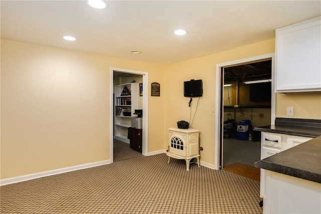 61 Brookside Cir, Big Flats, NY 14903 - kitchen with dark countertops, white cabinets, carpet, recessed lighting, and baseboards