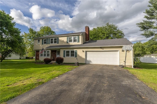 61 Brookside Cir, Big Flats, NY 14903 - view of front facade with asphalt driveway, a chimney, an attached garage, and a front yard
