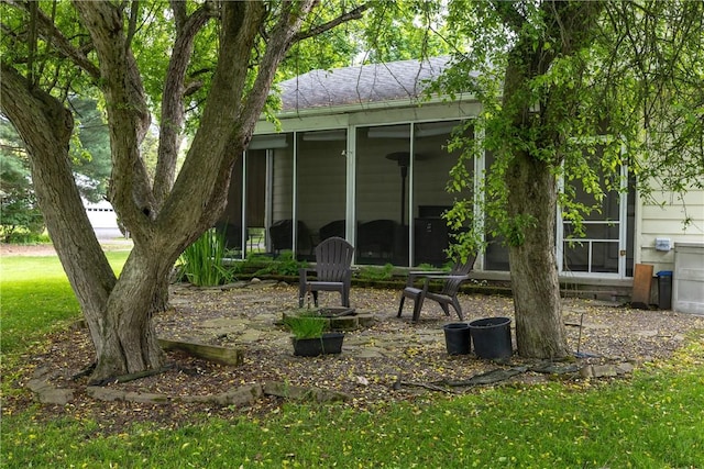61 Brookside Cir, Big Flats, NY 14903 - back of house with a sunroom and a lawn