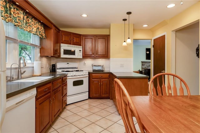61 Brookside Cir, Big Flats, NY 14903 - kitchen featuring white appliances, a sink, dark countertops, a peninsula, and decorative backsplash