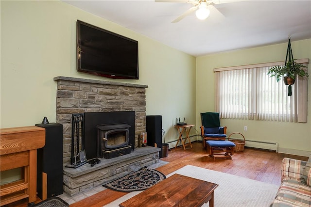 61 Brookside Cir, Big Flats, NY 14903 - living area featuring baseboard heating, wood finished floors, a ceiling fan, and baseboards