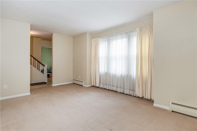61 Brookside Cir, Big Flats, NY 14903 - unfurnished room featuring baseboard heating, carpet, and baseboards