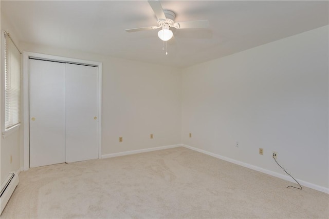 61 Brookside Cir, Big Flats, NY 14903 - unfurnished bedroom with a baseboard radiator, carpet, baseboards, ceiling fan, and a closet