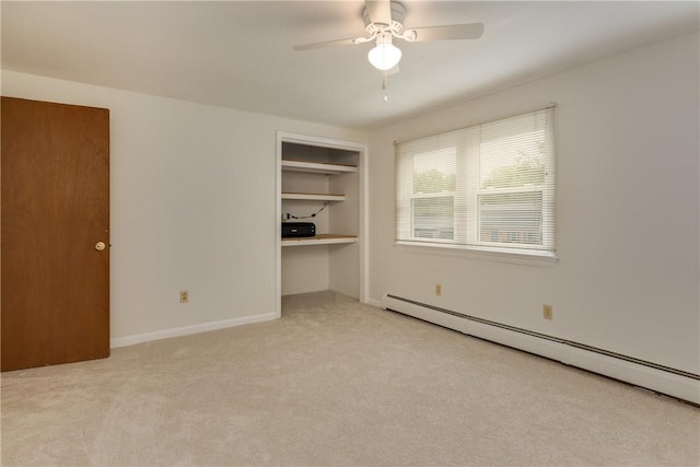 61 Brookside Cir, Big Flats, NY 14903 - unfurnished bedroom with baseboard heating, light carpet, a closet, a ceiling fan, and baseboards
