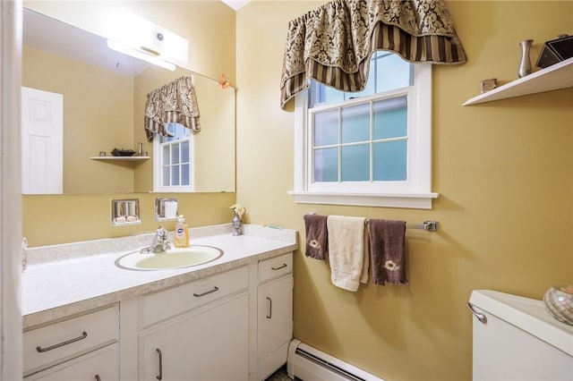 126 True Hickory Dr, Greece, NY 14615 - bathroom featuring vanity, toilet, and a baseboard radiator