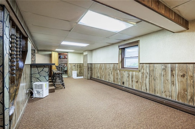 126 True Hickory Dr, Greece, NY 14615 - below grade area featuring a wainscoted wall, a baseboard radiator, carpet, a bar, and wooden walls
